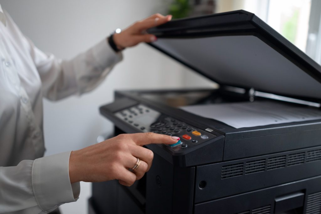 a lady printing document with black colour printer