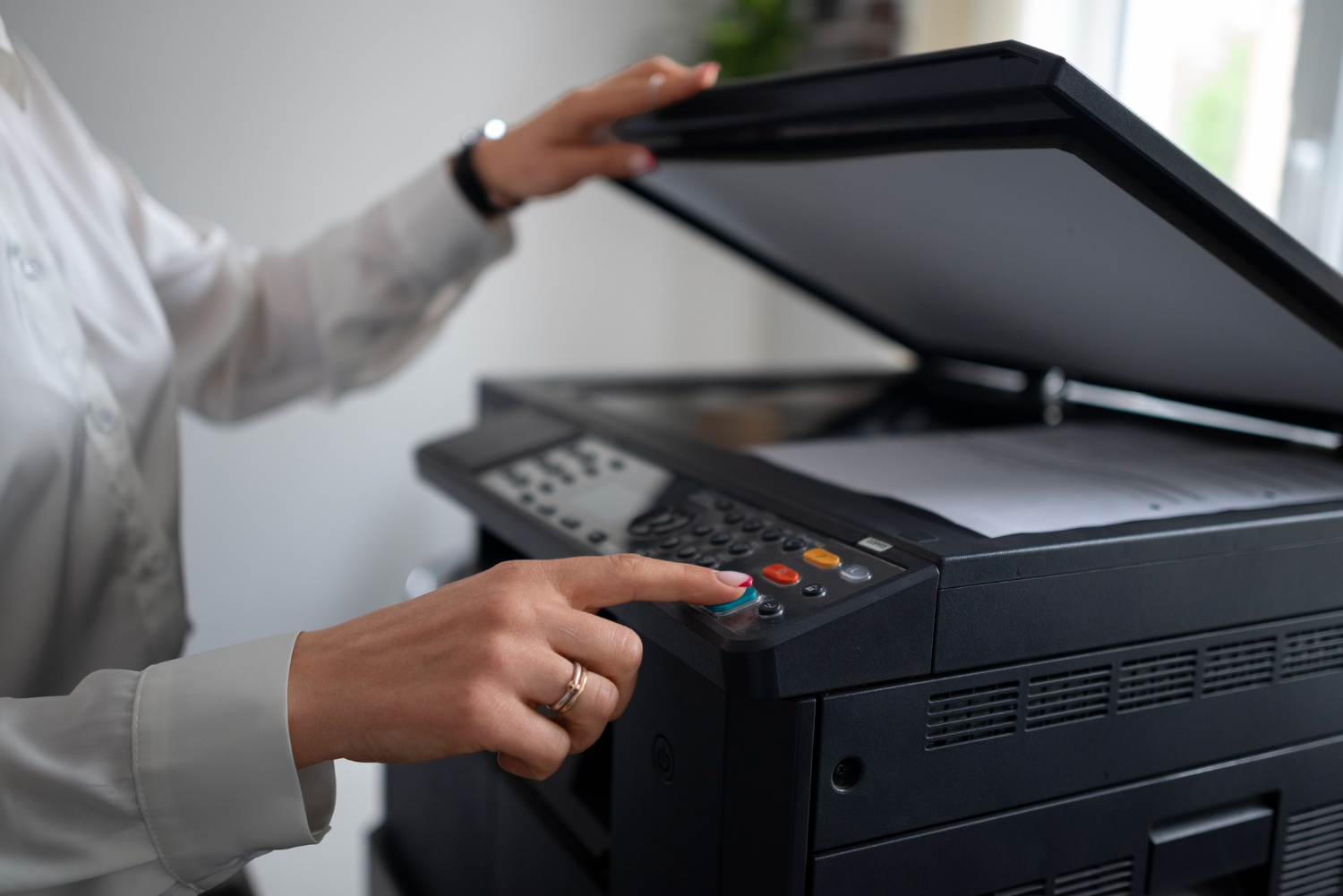 a lady printing document with black colour printer